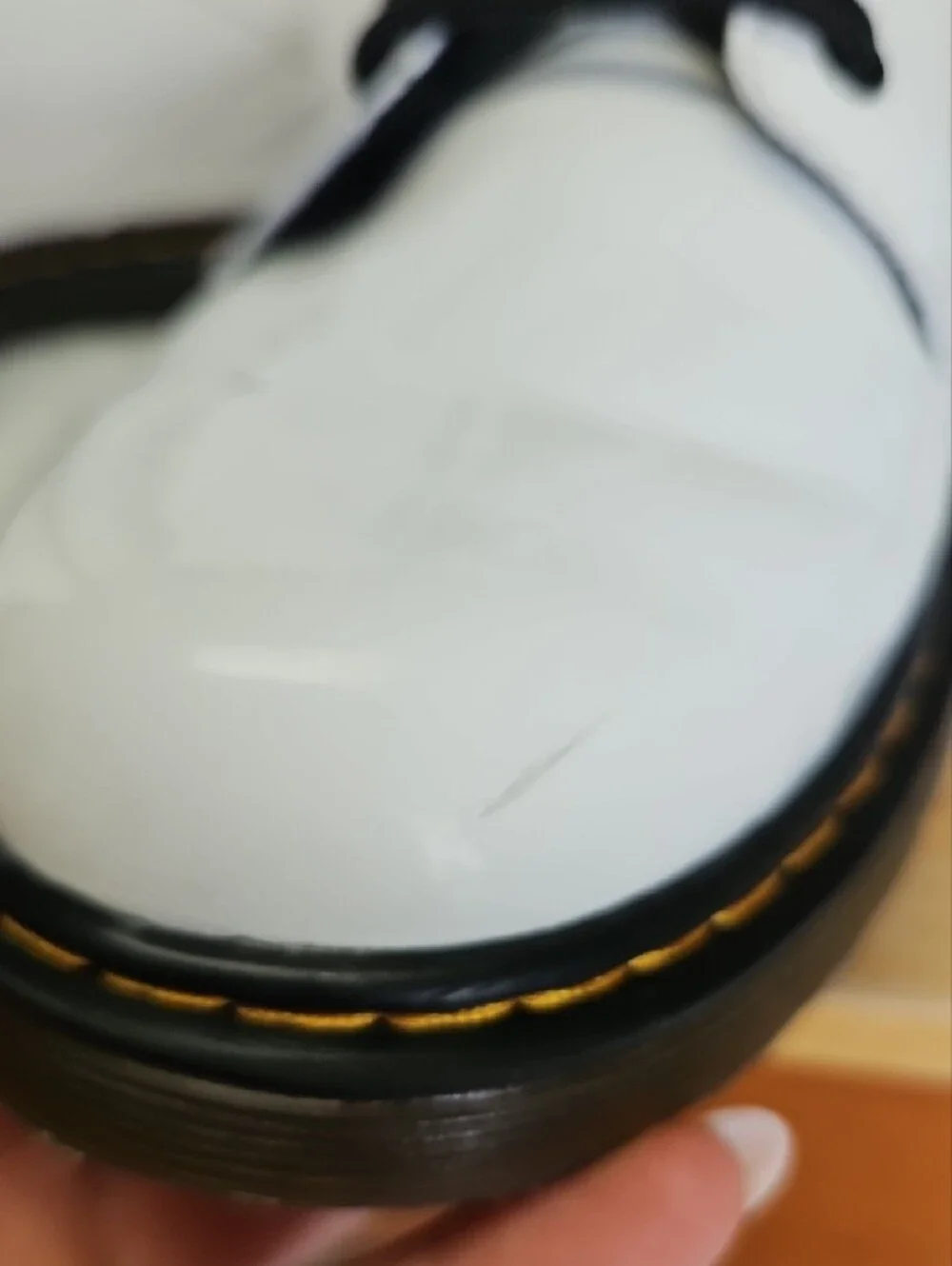 Dr. Martens White Patent Lace-Up Boots with Black Laces